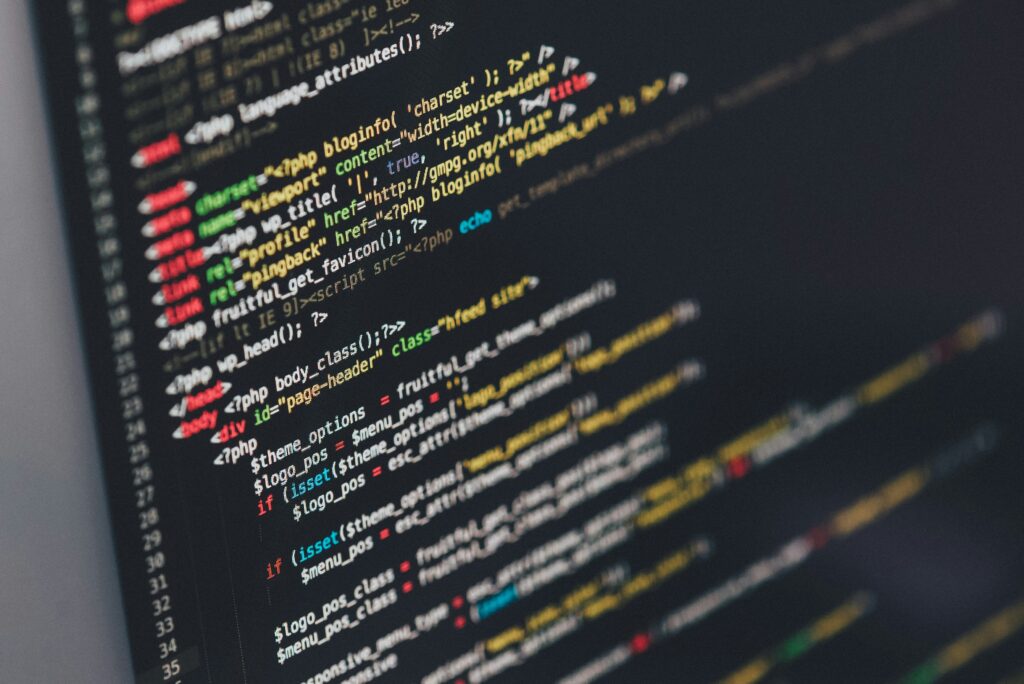 Laptop showing website coding and programming