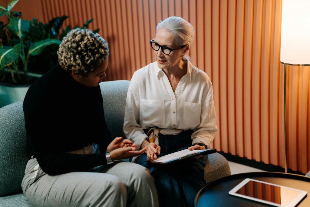 Two marketing professionals having a conversation.